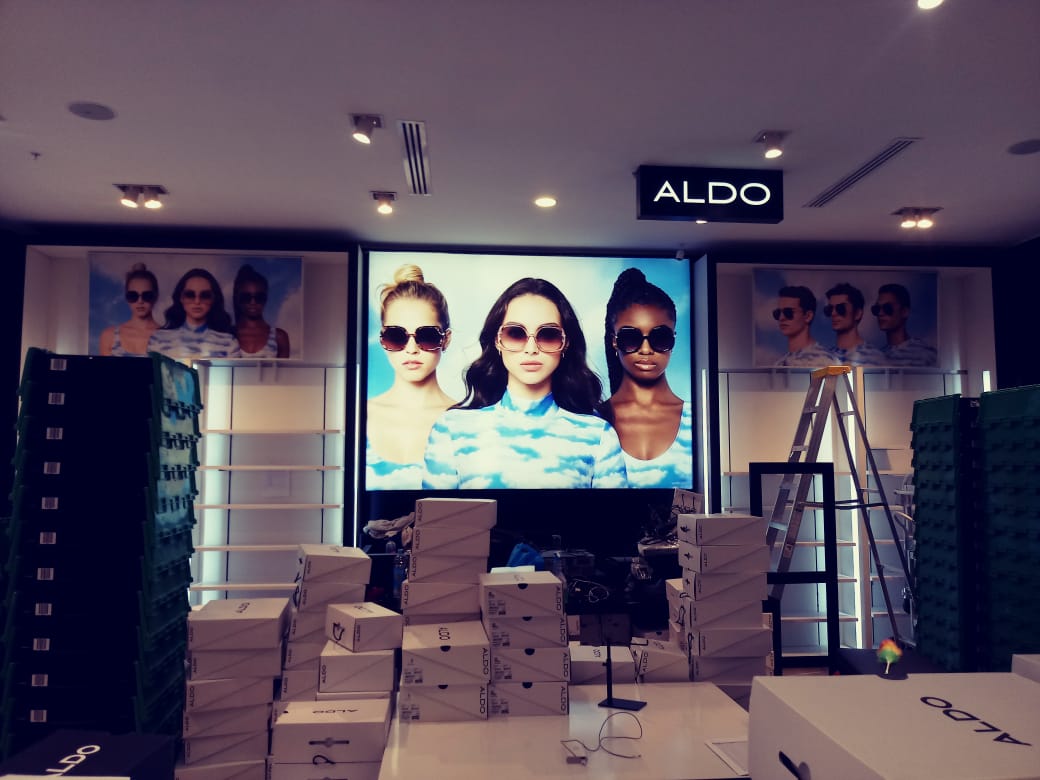 light up poster with three women in sunglasses